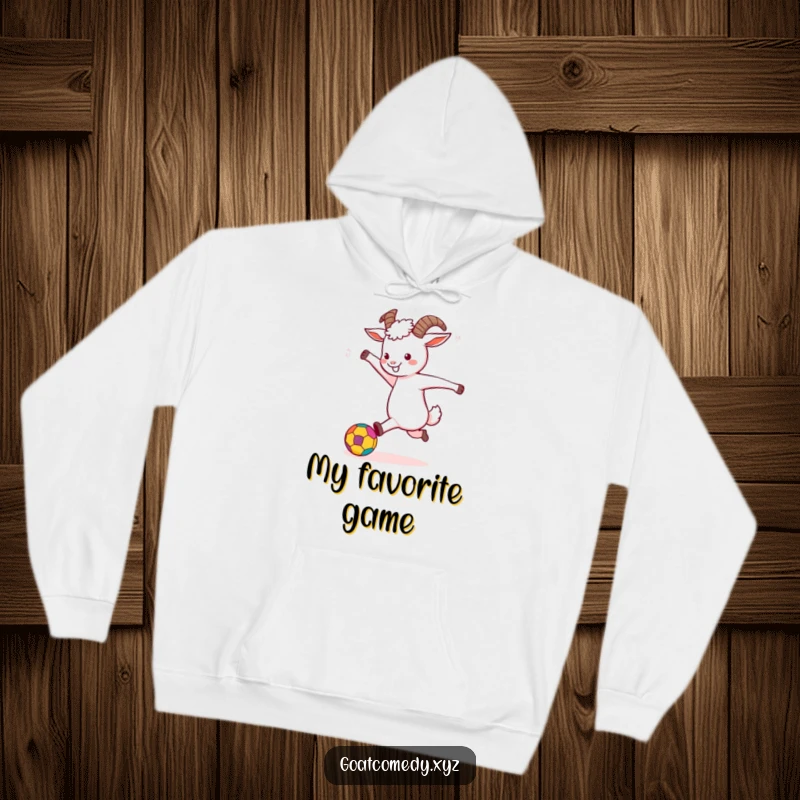 Funny Goat Hoodie depicting a goat joyfully kicking a colorful ball, perfect for cozy, active wear.