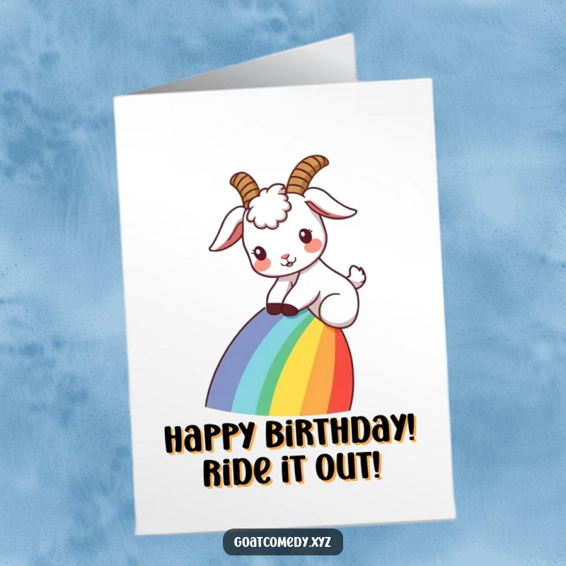 Funny Free Printable Birthday Card: A goat with ears back joyfully slides down a vibrant rainbow, spreading happiness.
